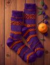 Knitted Socks on Wooden Background