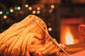 knitted sweater and fireplace in background cozy Christmas scene Royalty Free Stock Photo