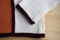 Knitted sweater; fragment. Handmade fabric. Knitted fabric consists of various structures.