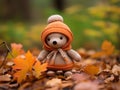 a knitted teddy bear wearing an orange sweater and hat Royalty Free Stock Photo