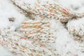 Knitted textile background with snow