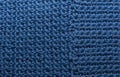 Knitted texture, front surface. Natural wool, classic blue, monochrome. Close-up, background