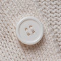 Knitted texture with a white button