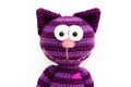 Knitted toy - striped smiling cat.