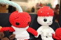 Knitted toys are located on the shelf. Toys at the fair. Handmade. Knitting. Hobby. Kids toys. Gifts for the New
