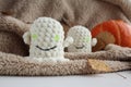 Knitted toys on a table. Natural. Knitted ghosts. Product layout. Knitting. Hobby. flatlay