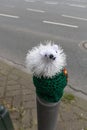 A knitted white hedgehog as an outdoor pole topper on the street in Bochum, Germany