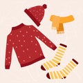 Knitted winter and autumn clothes set, isolated on white background. Sweater, socks, scarf top view vector cartoon illustration. Royalty Free Stock Photo