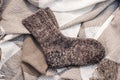 Knitted wool socks pair on fabric. warming socks. autumn mood. winter mood.