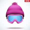 Knitted woolen cap with snow goggles. Winter