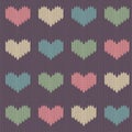 Knitted woolen seamless pattern with colored hearts on a vintage purple background