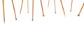 Knitting banner background. Wooden bamboo knitting needles on white background
