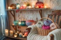 knitting basket beside a chair, candles on nearby shelves