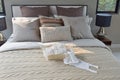 Knitting basket on warm classic style bedding with many texture of pillows