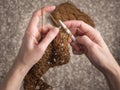 knitting with brown yarn over brown background