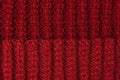 Knitting canvas texture. Red or burgundy color