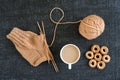 Knitting with coffee and ring-shaped cracknels Royalty Free Stock Photo
