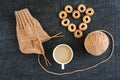 Knitting with coffee and ring-shaped cracknels Royalty Free Stock Photo