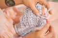 Knitting crochet process close up. Hands with knitwork. Warm toned photo Royalty Free Stock Photo