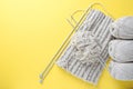 Knitting flatlay. A horizontal collage of knitwear, skeins of yarn and knitting needles on a bright background. Copy space.