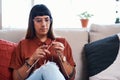 Knitting is like a meditation session. a young woman knitting while relaxing at home. Royalty Free Stock Photo