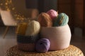 Knitting material. Skeins of soft yarn and crochet hooks on table indoors Royalty Free Stock Photo