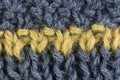 Grey an yellow knitted wool fabric macro closeup Royalty Free Stock Photo