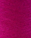 Magenta wool thread spool macro close up Royalty Free Stock Photo