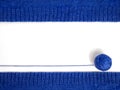 Knitting on needles. Top view of a blue ball of yarn on a white background, among knitted fabrics. Hobby.