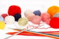 Knitting needles and wool balls Royalty Free Stock Photo