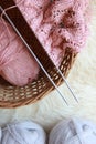 Knitting needles with yarn and a ball of thread,