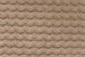 Knitting pattern of wool. Knitting. Texture of knitted woolen fabric for wallpaper and an abstract background Royalty Free Stock Photo