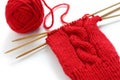 Knitting a red yarn ball with noodles Royalty Free Stock Photo