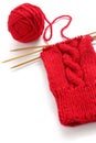 Knitting a red yarn ball with noodles