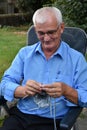 Knitting senior man