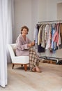 Knitting, senior woman and happy in a retirement home with wool, smile and crochet for scarf. Old person, creativity and Royalty Free Stock Photo