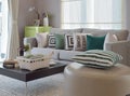 Knitting set in cozy living room with gray sofa and retro pillows