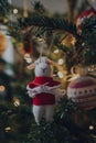 Knitting sheep in a red jumper felt Christmas decoration on a Christmas tree