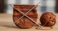 Knitting is shown in progress featuring brown and red variegated Royalty Free Stock Photo