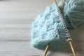 Knitting, soft turquoise yarn and needles on white wooden table, closeup Royalty Free Stock Photo