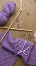 Knitting tools and purple yarn bundle Royalty Free Stock Photo