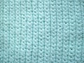 Knitting with turquoise wool yarn, close-up of pattern