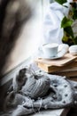 knitting on the window of a cup of coffee book hobby handmade Royalty Free Stock Photo