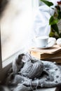 knitting on the window of a cup of coffee book hobby handmade Royalty Free Stock Photo