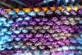 Knitting on wooden knitting needles from violet blue purple yarn close-up. Hobby, homemade Royalty Free Stock Photo