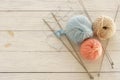 Knitting wool and knitting needles in pastel blue and pink colors Royalty Free Stock Photo