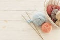 Knitting wool and knitting needles in pastel blue and pink colors Royalty Free Stock Photo