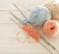 Knitting wool and knitting needles in pastel blue and pink colors Royalty Free Stock Photo