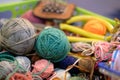 knitting yarn ball, sewing needle, scissors. handmade handicraft