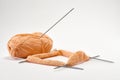 Knitting with yarn on knitting needles, skein of yarn. Royalty Free Stock Photo